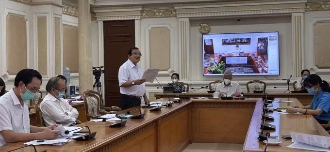 Ông Lê Minh Tấn - Giám đốc Sở LĐ-TB-XH TP. HCM (người đứng báo cáo).