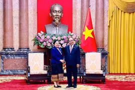 Việt Nam - Lào cùng nhau phối hợp, hỗ trợ, chia sẻ kinh nghiệm trong công tác xây dựng Đảng