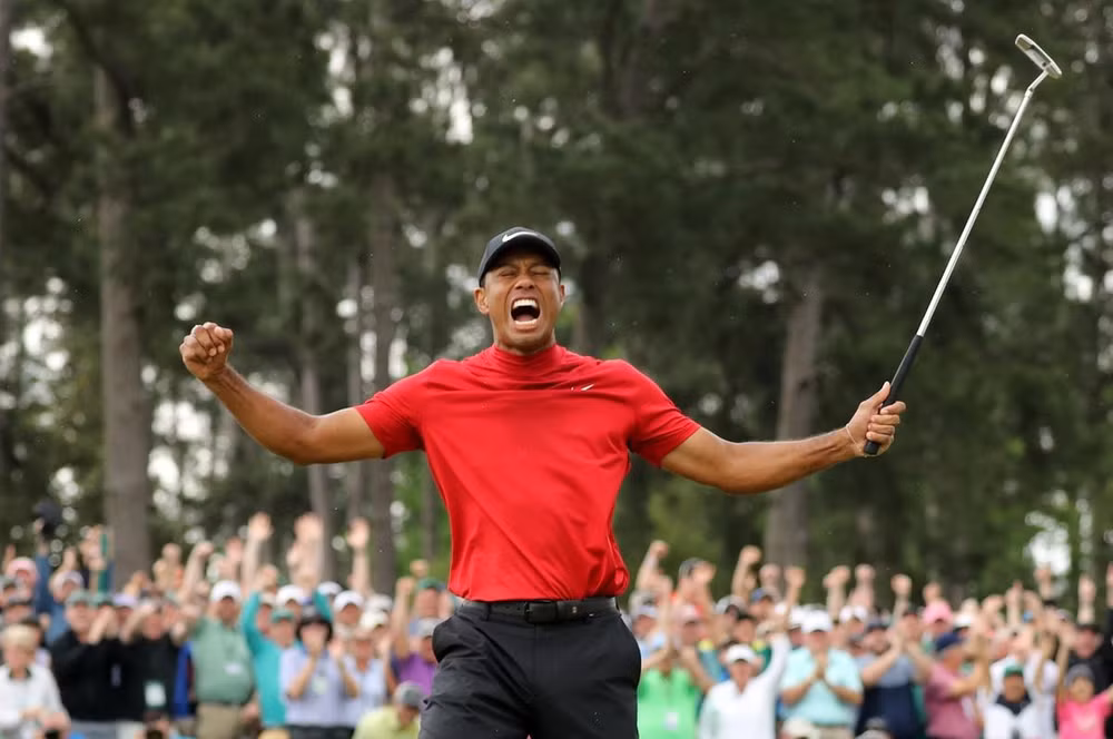Tiger Woods ăn mừng chiến thắng. Ảnh: Reuters