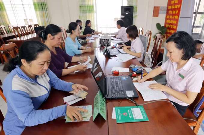 Hoạt động của NHCSXH tại các Điểm giao dịch xã trong cả nước.(Hình ảnh thực hiện trước ngày 01/4/2020) Ảnh: Trần Việt
