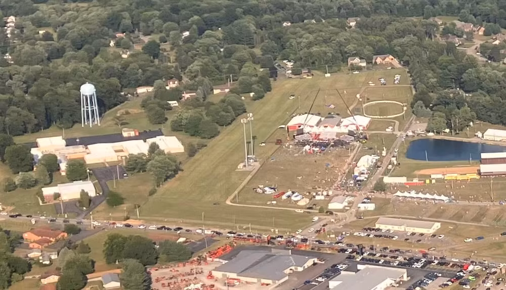 Close-up aerial view showing the Butler Farm Show Grounds (right) on the day of the rally with the building (left) that the shooter climbed on