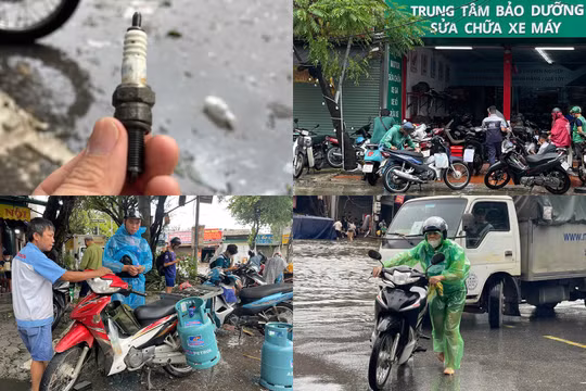 Mưa lớn, thợ sửa xe máy Hà Nội kiếm tiền triệu ở những điểm ngập lụt