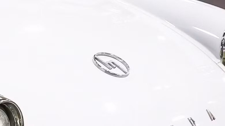 A Mazda 360 kei car wearing Mazda's first car logo
