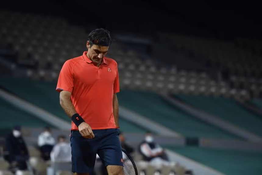 Federer không thể hẹn so tài với Djokovic ở tứ kết. Ảnh: Getty Images