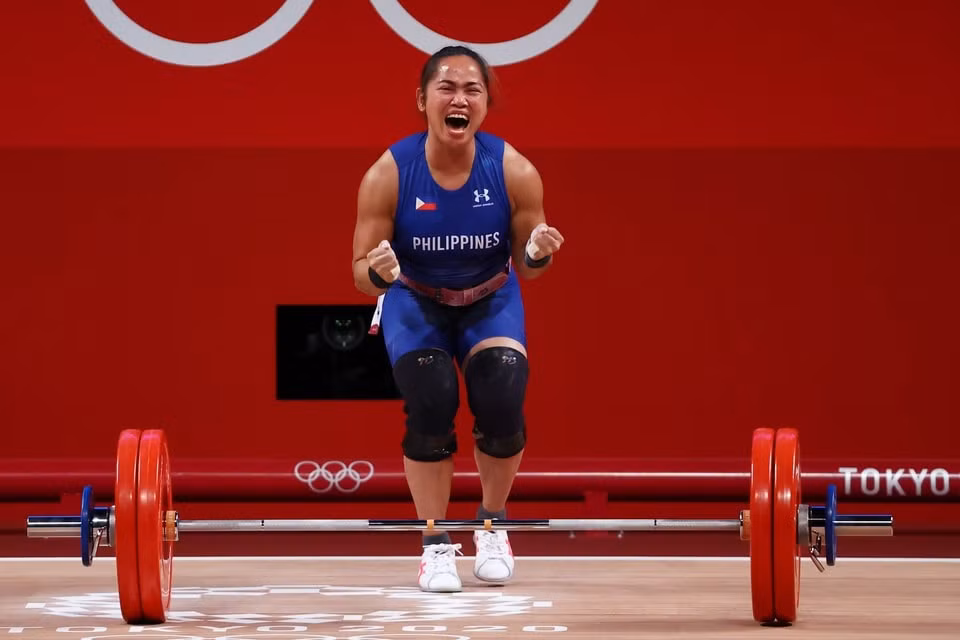 Vận động viên Diaz vui mừng khi thành công ở mức cử đẩy 127 kg. Ảnh: Reuters