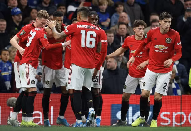 Các cầu thủ Manchester United ăn mừng bàn thắng ấn định chiến thắng 2 - 1. Ảnh: Getty