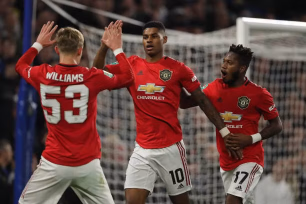 Rashford có 1 ngày thi đấu ấn tượng với cú đúp vào lưới Chelsea. Ảnh: Getty