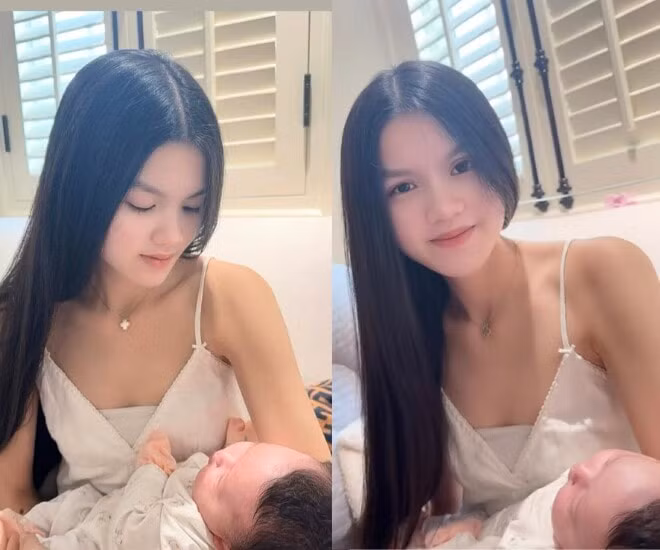 Khoảnh khắc con gái lớn của Phương Lê bế bồng em gái.