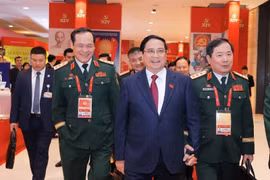 Các đại biểu đến dự ngày làm việc thứ tư Đại hội XIV của Đảng