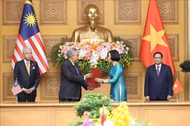 Thông tấn xã Việt Nam trao đổi Thỏa thuận hợp tác nghiệp vụ với Hãng thông tấn quốc gia Malaysia