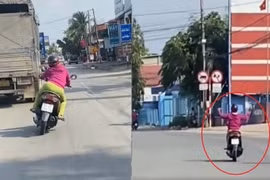 Bình Dương: Một phụ nữ phóng xe máy lạng lách đánh võng, buông 2 tay trên quốc lộ 13