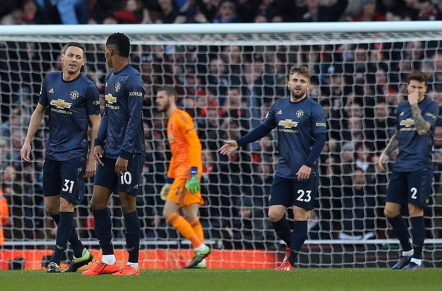 Manchester United có một ngày thi đấu đáng quên tại Emirates. Ảnh: Getty