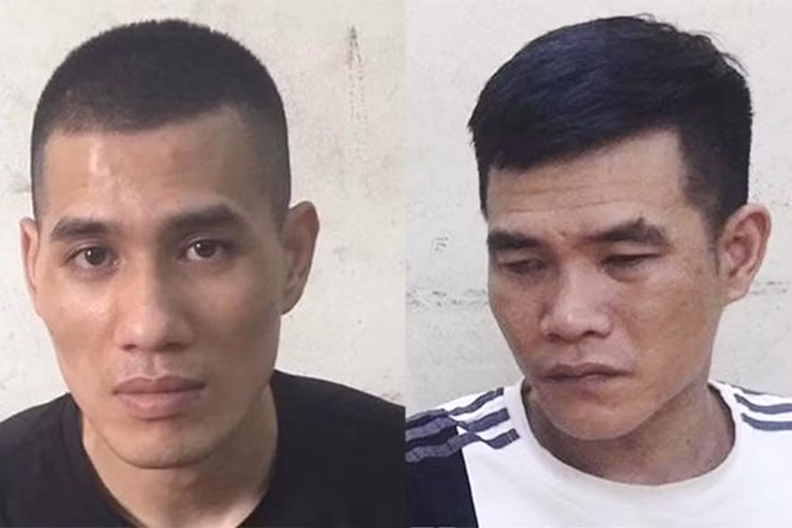 Hai bị can Giang và Hùng (từ trái qua) đập phá ôtô để trộm cắp tài sản. Ảnh: CACC