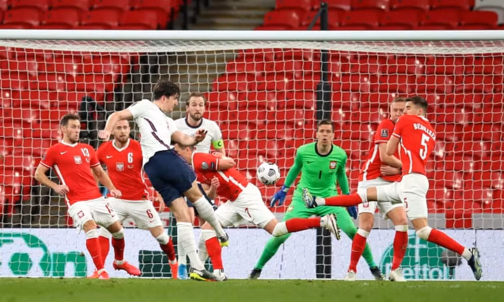 John Stones chuộc lỗi với pha kiến tạo cho Harry Maguire ghi bàn. Ảnh: Getty