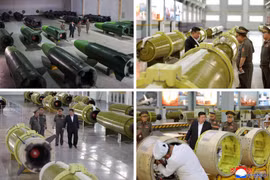 Ông Kim Jong Un kiểm tra dây chuyền sản xuất tên lửa mới khánh thành
