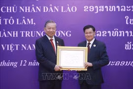 Tổng Bí thư Tô Lâm nhận Huân chương Vàng Quốc gia của Nhà nước Lào