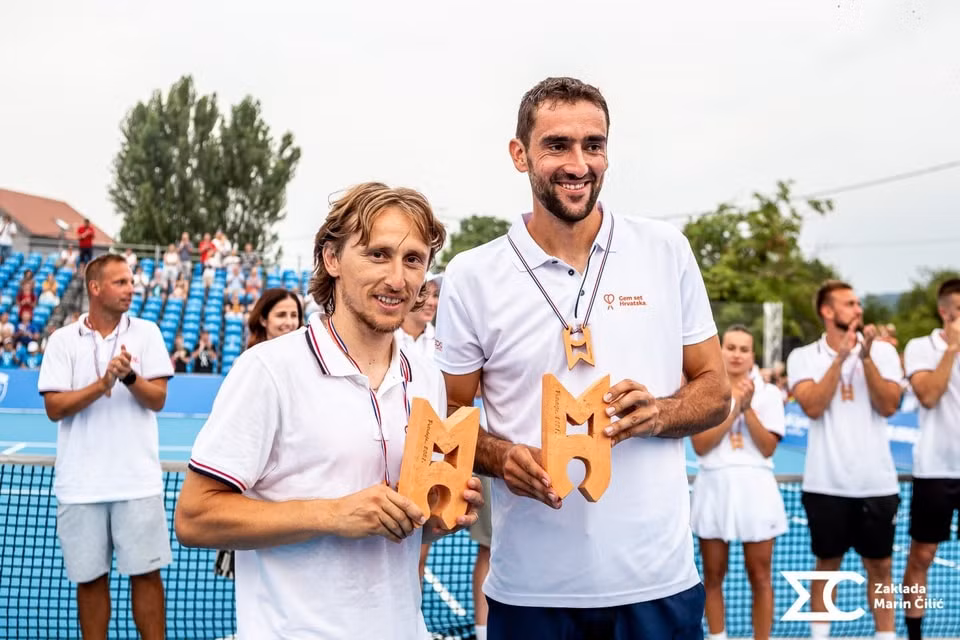 Ngôi sao bóng đá Modric và Cilic vô địch đôi nam. Ảnh: Envy Croatia
