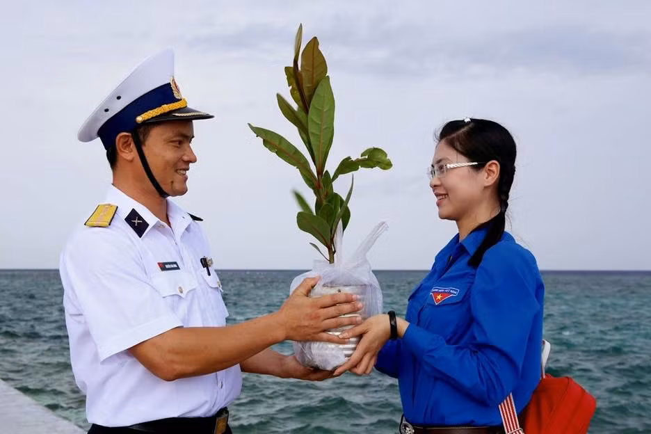 A person and person holding a plant AI-generated content may be incorrect.