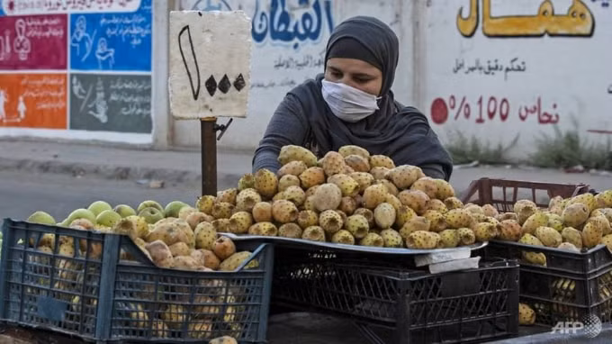 Một người bán hàng rong tại Syria. Ảnh: AFP