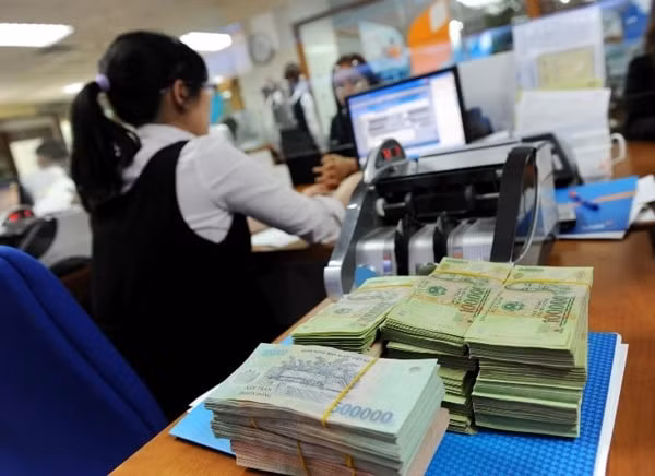 Do ảnh hưởng của dịch bệnh Covid-19, nhiều người nộp thuế gặp khó khăn, dẫn đến chậm nộp tiền thuế vào ngân sách nhà nước. Ảnh minh họa