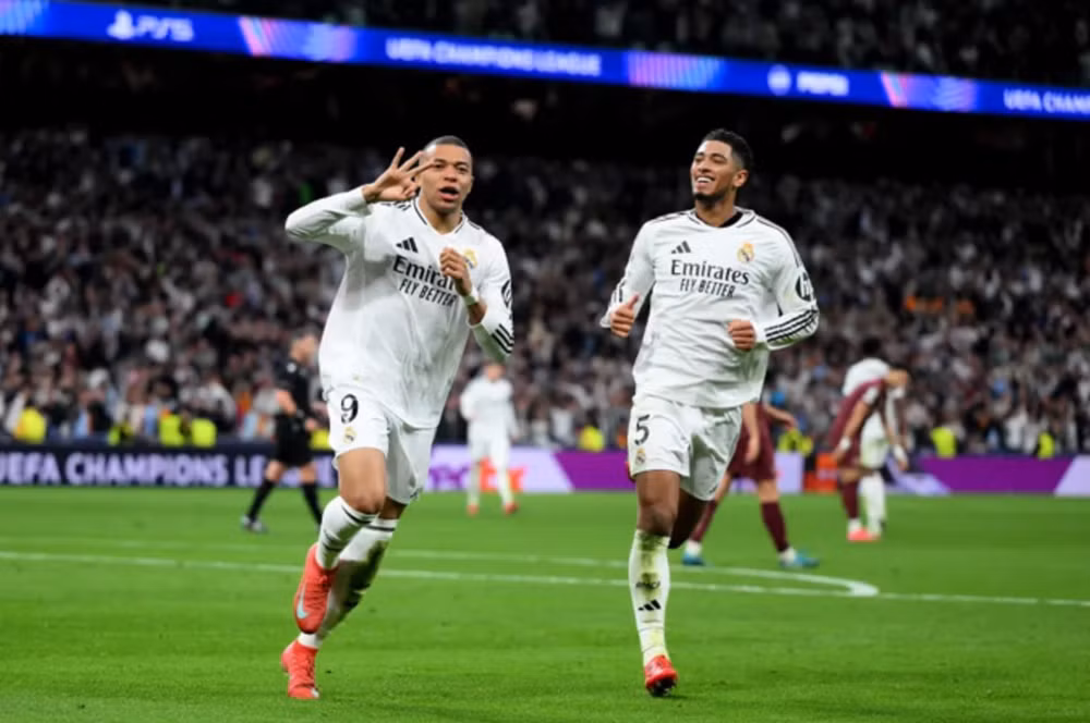 danh bai man city real madrid gianh ve vao vong 1 8 champions league 2024 25 hinh 1