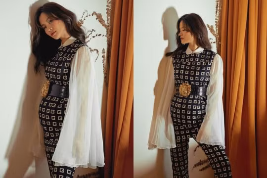 Đông Nhi trèo hẳn lên cửa sổ và kiễng chân để chụp ảnh khiến fan hốt hoảng