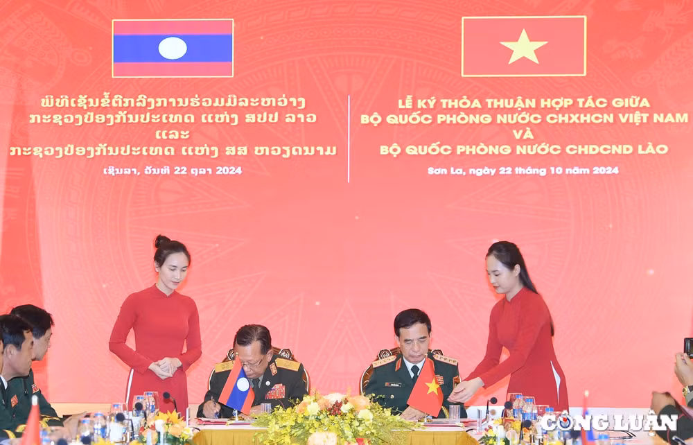 viet nam lao cung nhau xay dung duong bien gioi hoa binh huu nghi hop tac va phat trien hinh 4