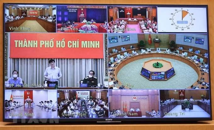 Cuộc họp trực tuyến từ điểm cầu Chính phủ đến các tỉnh, thành phố. Ảnh: TTXVN