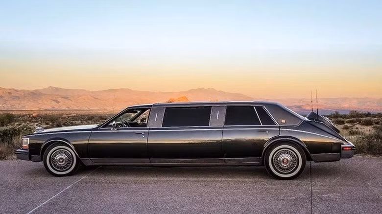 A side view of a black Cadillac Seville limo