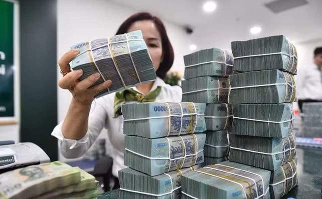 nhieu ngan hang dong loat giam lai suat tien gui dau nam moi hinh 1