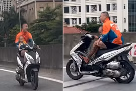 Xác minh nam thanh niên bế em bé, chạy xe máy lên đường Vành đai 3 trên cao