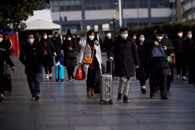 Người dân tại Bắc Kinh, Trung Quốc. Ảnh: Reuters