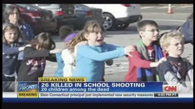 Các học sinh rời khỏi hiện trường vụ xả súng ở Sandy Hook. Ảnh: CNN