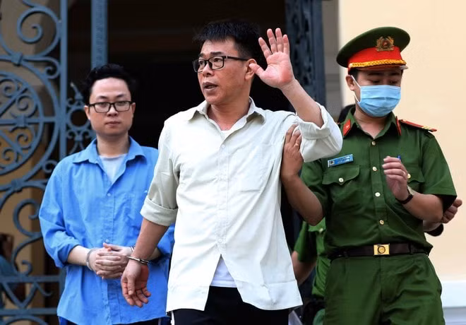 Hai bị cáo Nguyễn Hải Nam và Lâm Hoàng Tùng.