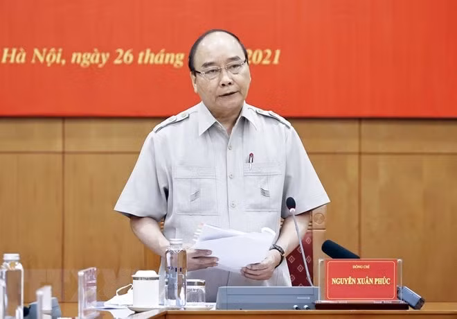 Chủ tịch nước Nguyễn Xuân Phúc đề nghị Tòa án Nhân dân Tối cao hoàn thiện Đề án liên quan đến xét xử trực tuyến bảo đảm không trái với đường lối của Đảng, pháp luật của Nhà nước. Ảnh: TTXVN