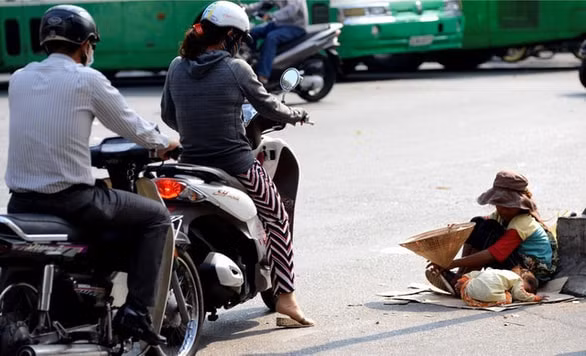 Một cảnh ăn xin trên đường phố ở TP.HCM. Ảnh: Duyên Phan