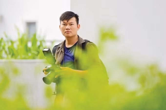 Phóng viên Trần Như Quỳnh - Báo Điện tử VnExpress, tác giả bộ ảnh “Hai cha con làm nghề móc cống ở Sài Gòn”.