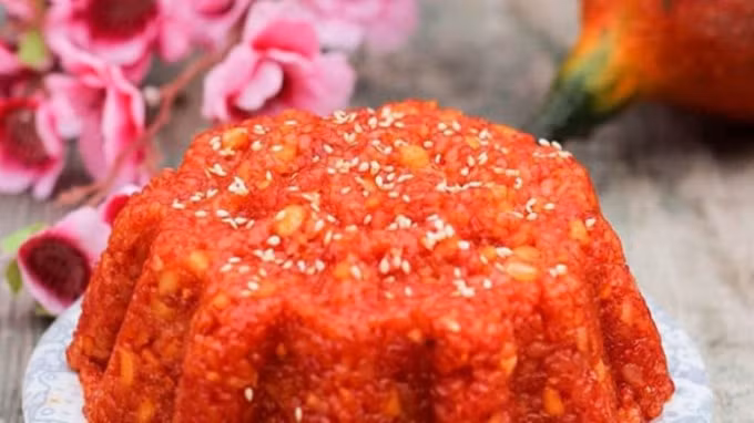 Món-ăn-may-mắn-ngày-tết-xôi-gấc-696x392